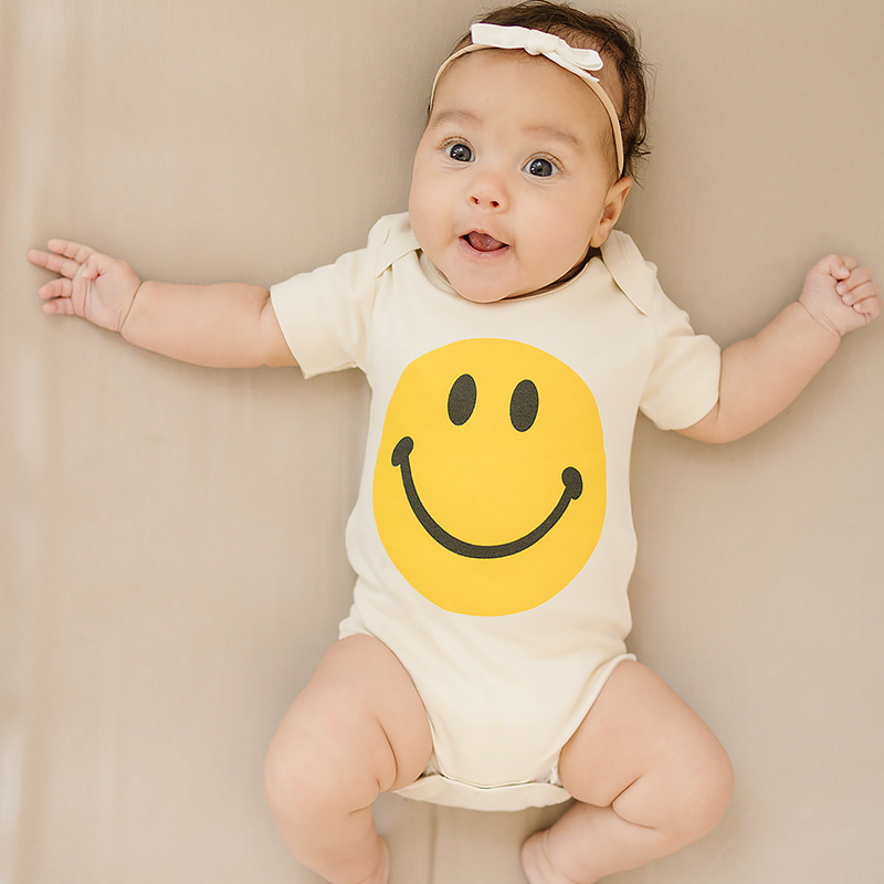 Yellow Smiley Face Organic Baby Onesie®