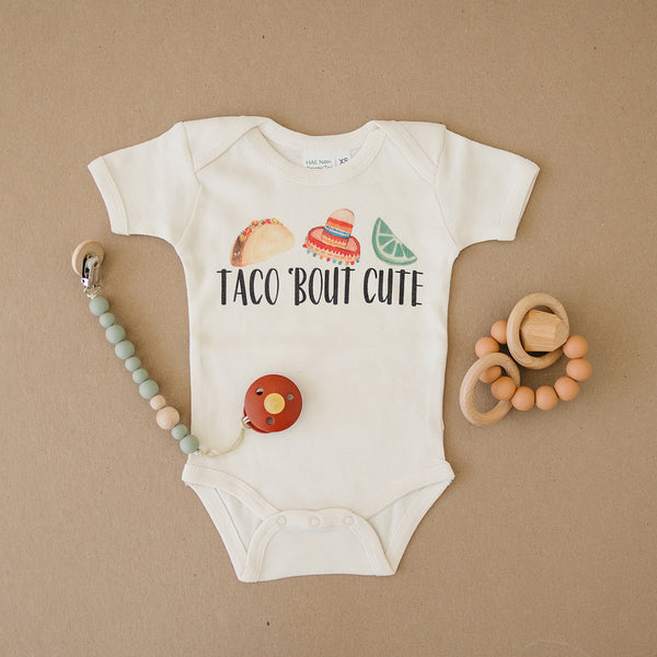 Taco Bout Cute Organic Baby Onesie®, Sandstone Teether, & Pacifier Clip With Pacifier Gift Bundle