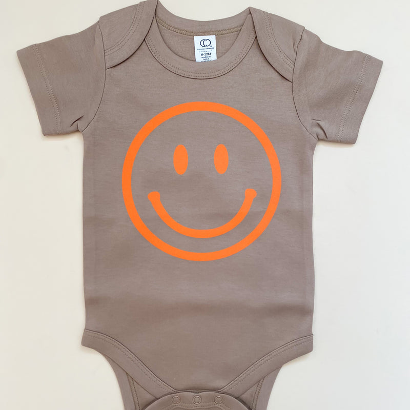Neon Orange Smiley Face Organic Baby Onesie®